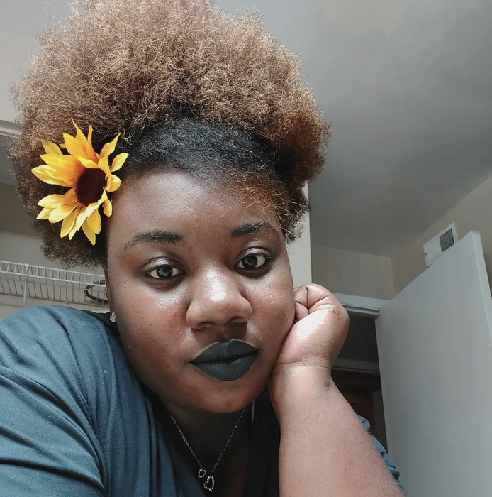 Reviewer flaunting NYX matte black lipstick