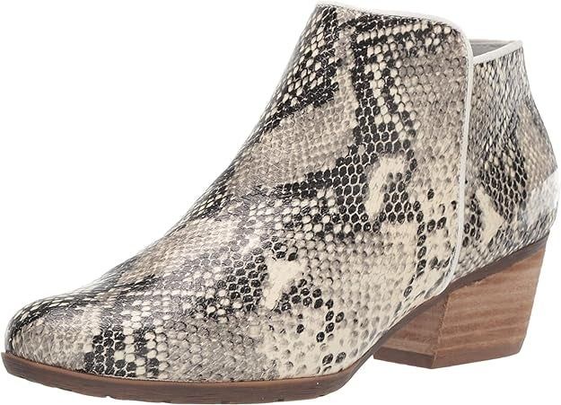 Ankle boot featuring a snakeskin print and a low, stacked heel.