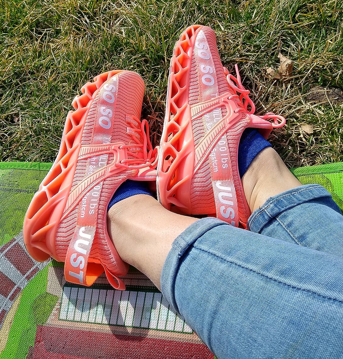 Reviewer wearing pink sneakers.