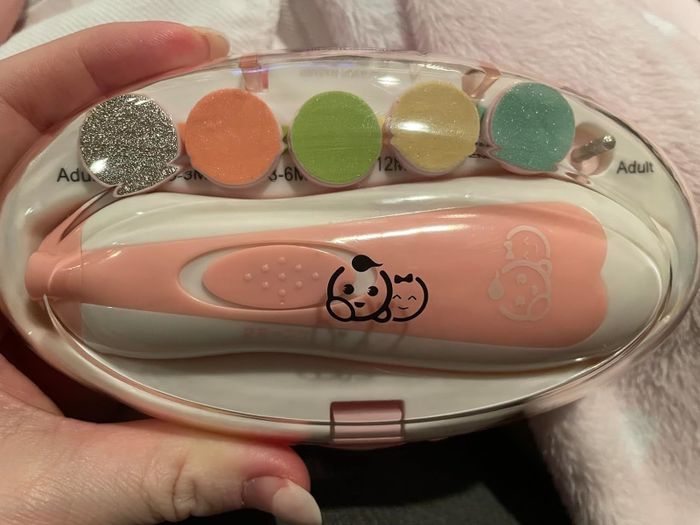 A pink electric nail file designed for babies