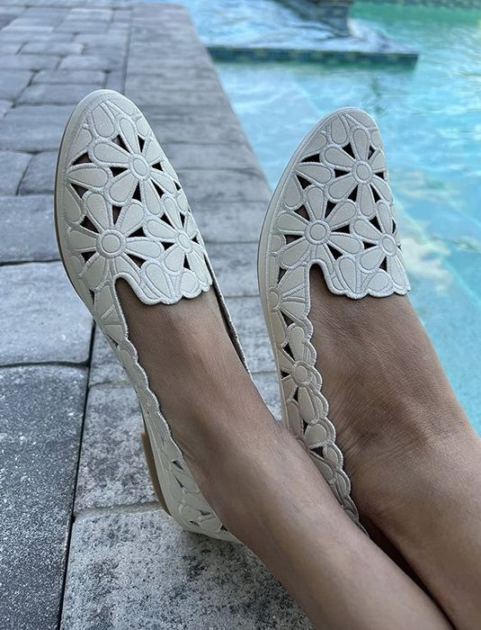 Reviewer wearing white floral cut-out flats