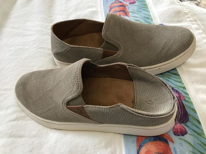 A reviewer’s slip-on sneakers with the back folded down
