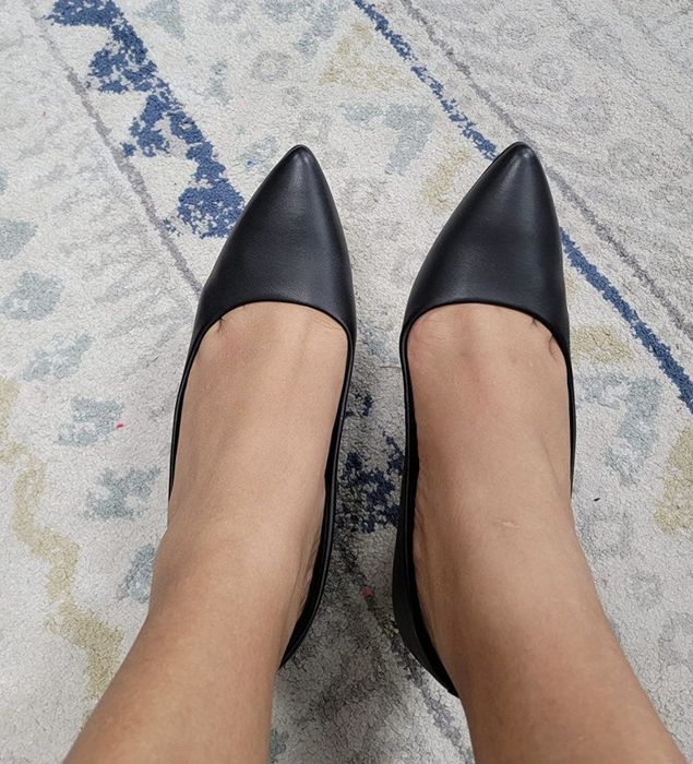 A top-down view of the shoes on a reviewer’s feet