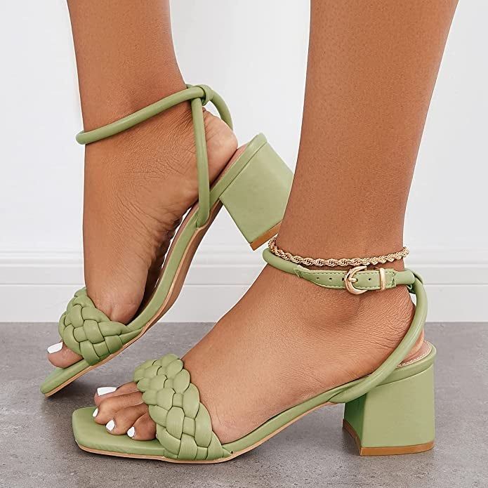 a model wearing the green braided heels