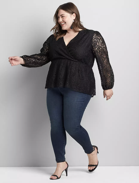 Model showcasing the Lane Bryant Surplice Peplum Blouse