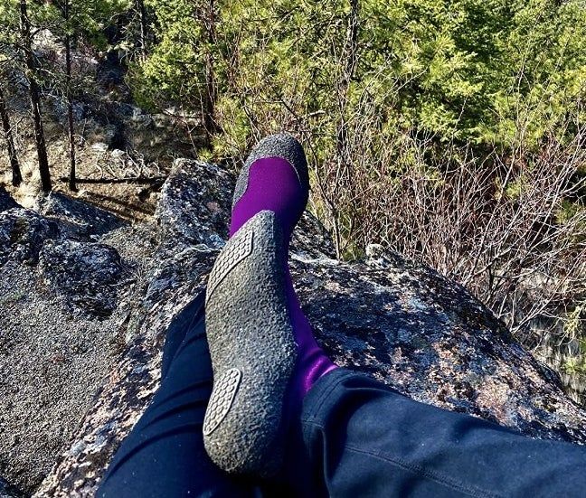Reviewer wearing sock-like shoes