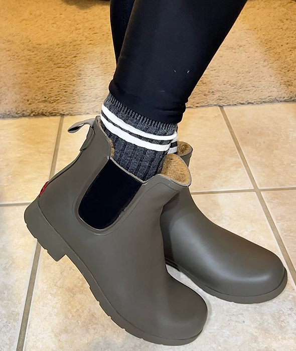 Reviewer wearing olive-colored waterproof Chelsea boots.