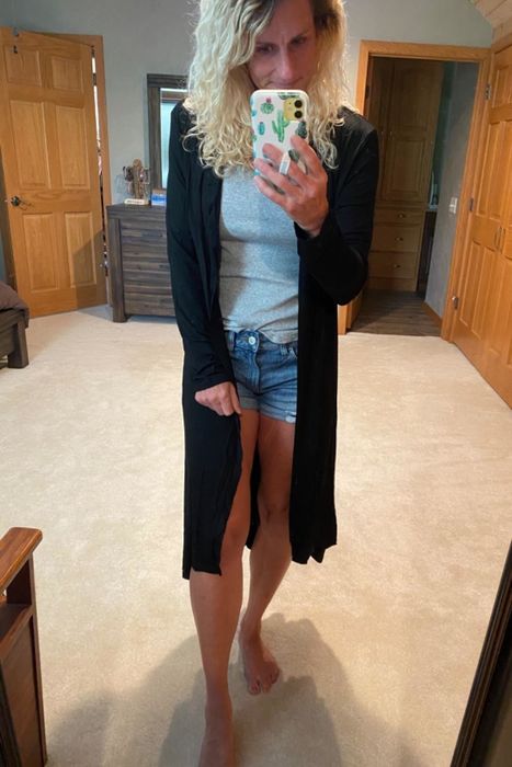 Reviewer wearing a duster-style cardigan
