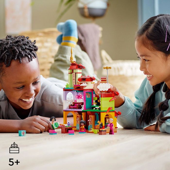 Two kids enjoying a Lego play session together.
