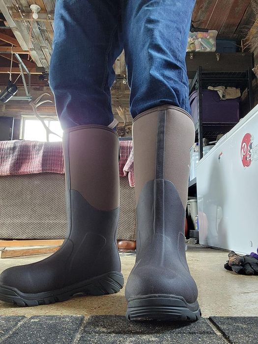 Reviewer showcasing the boots in use
