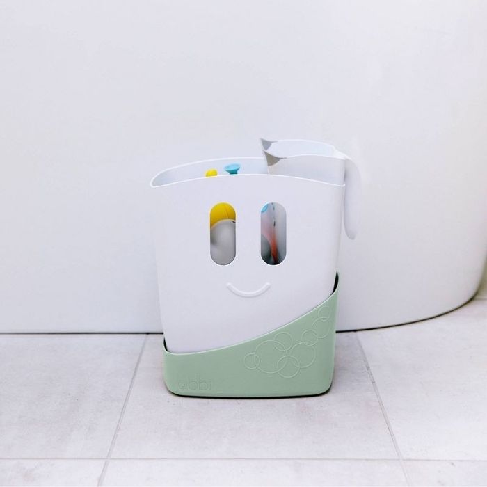 A bath toy drying bin filled with toys