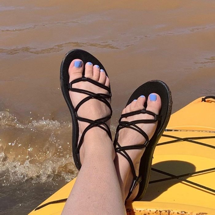Image of the sandals on a surfboard shared by the reviewer