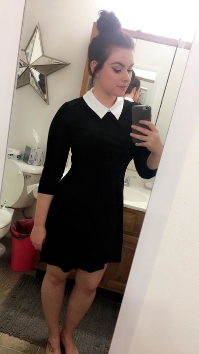 Reviewer styling the black Aphratti dress with a white collar