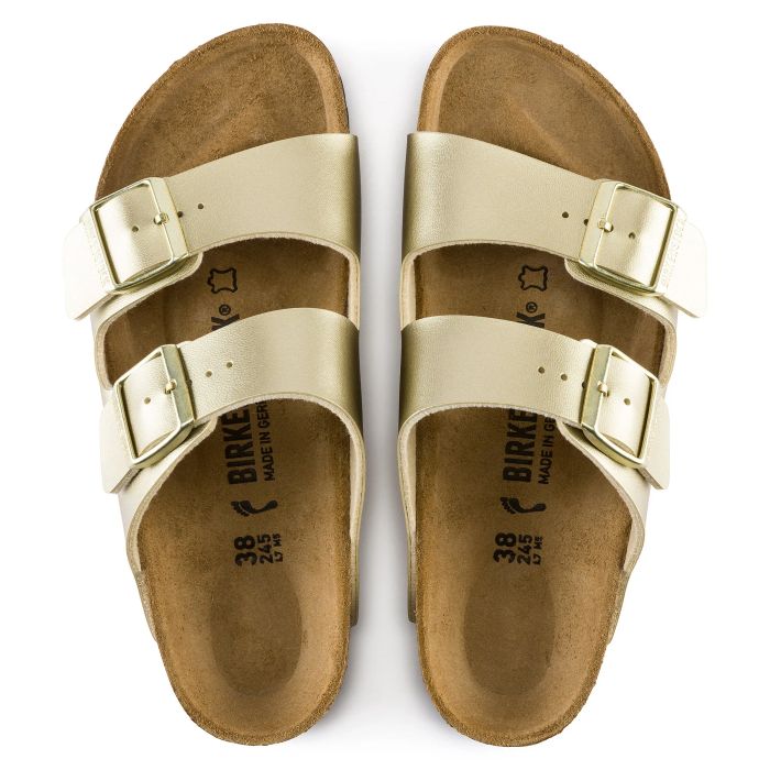 A top-down view of the gold Birkenstock sandals
