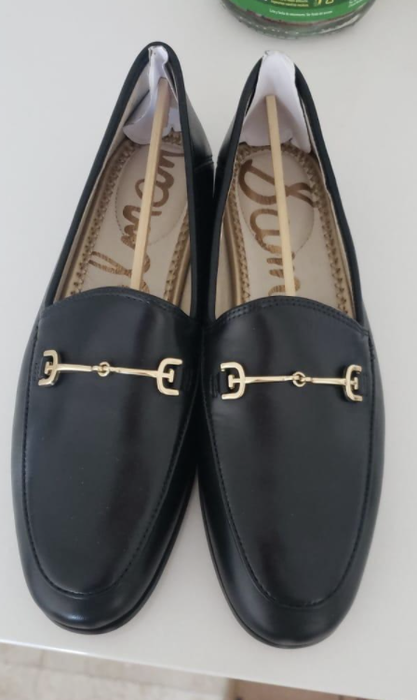 A photo of the reviewer wearing black loafers.