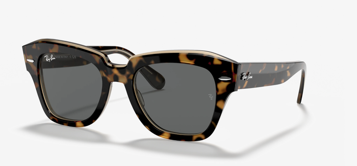 The brown and tan tortoiseshell sunglasses with thick rims.