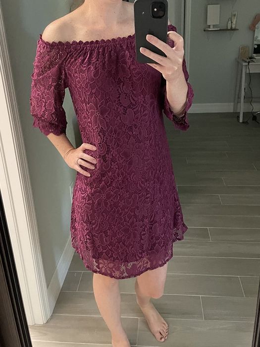 reviewer wearing the burgundy dress