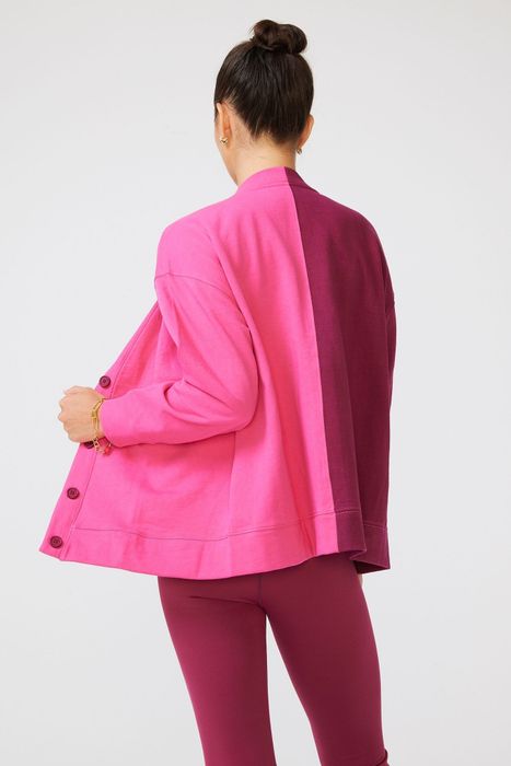 The back view of the two-tone pink sweater.