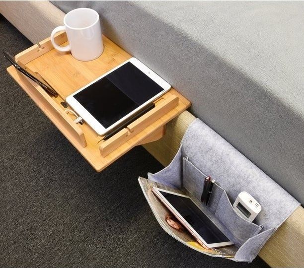 A shelf and organizer attached to a bed