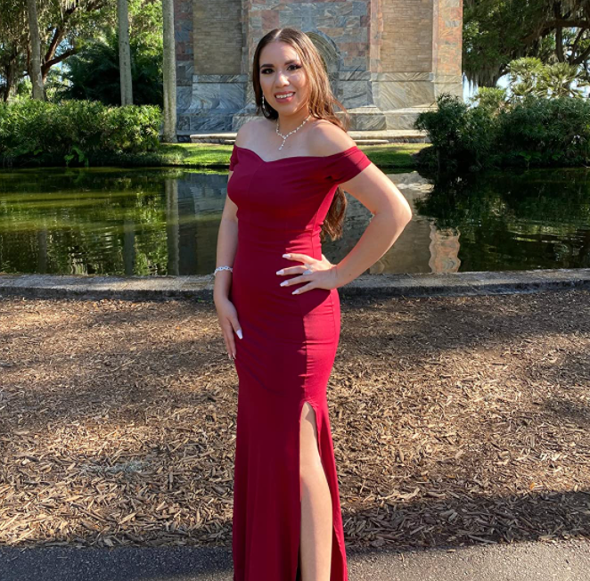 reviewer wearing a red dress