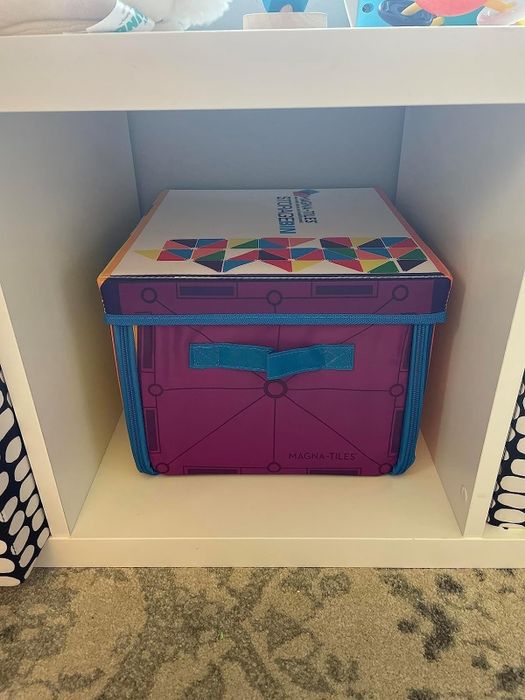 A storage container designed like a Magna-Tiles set, placed neatly on a shelf.