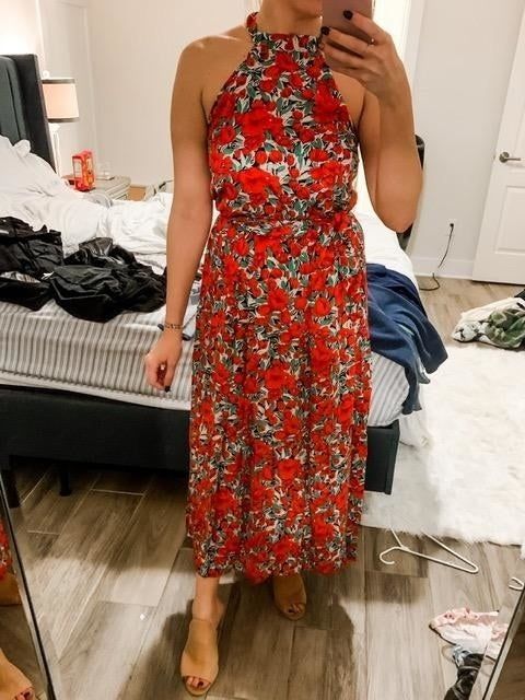 reviewer wearing the red dress