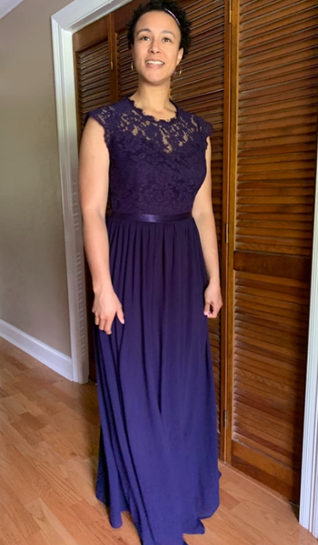 reviewer wearing a purple dress