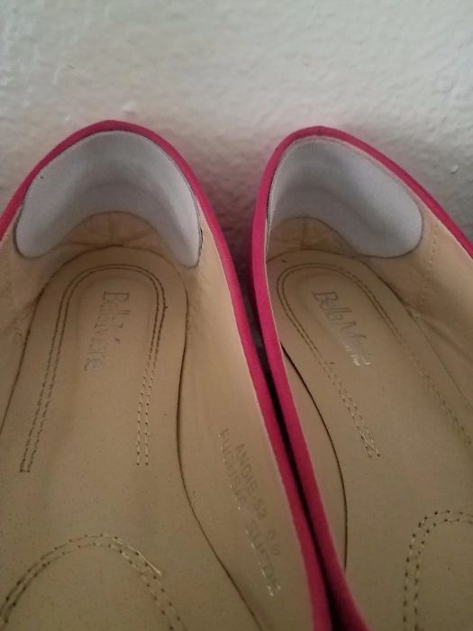 A photo showing the heel grips attached to the back of a pair of shoes