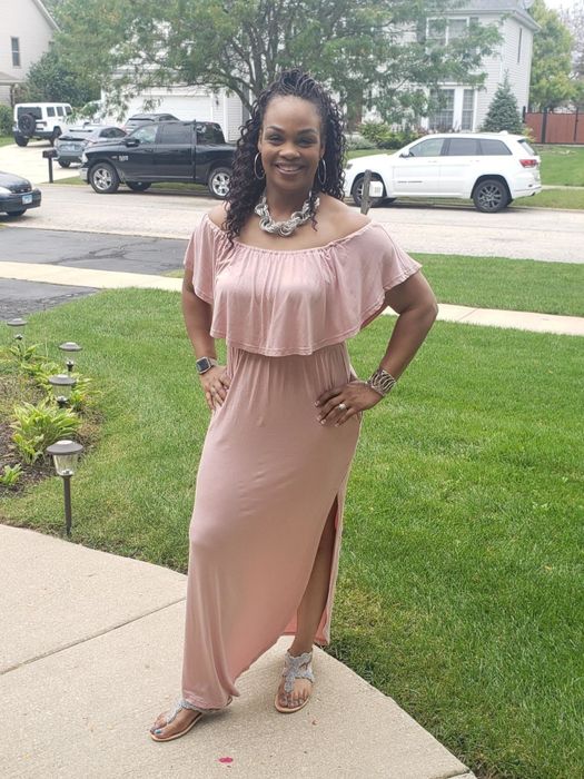reviewer wearing the pink dress