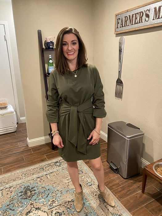 reviewer wearing the army green dress
