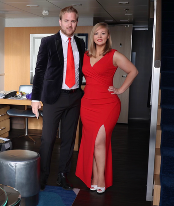 reviewer wearing a red dress with date