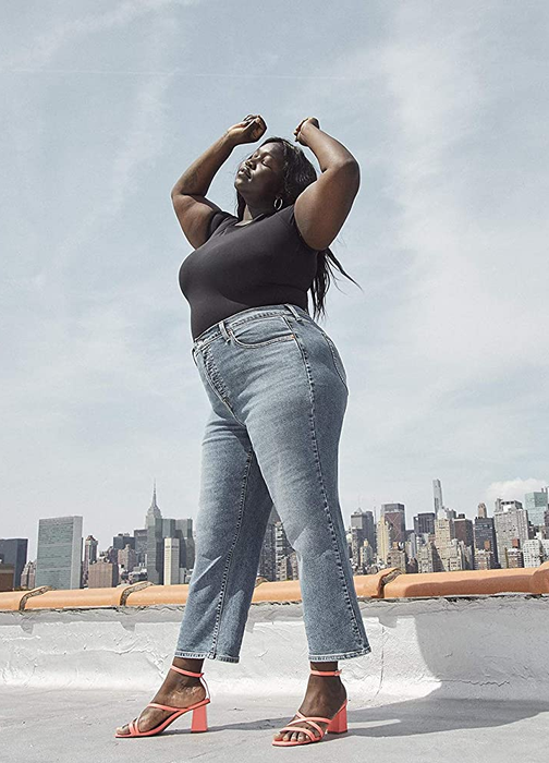 A model wearing the jeans in a greyish denim shade.
