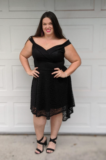 reviewer wearing a black dress