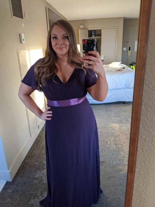 reviewer wearing the purple dress