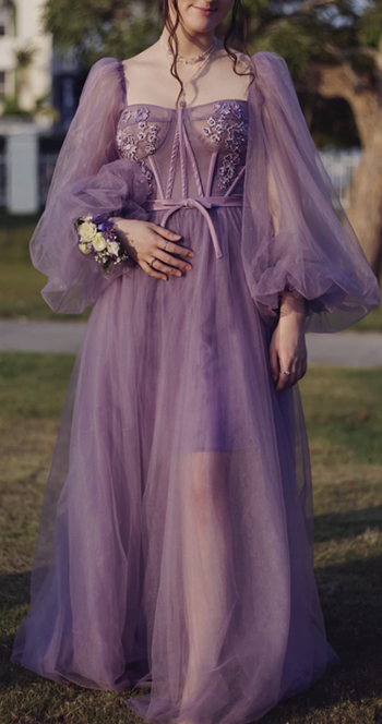 reviewer wearing a purple gown