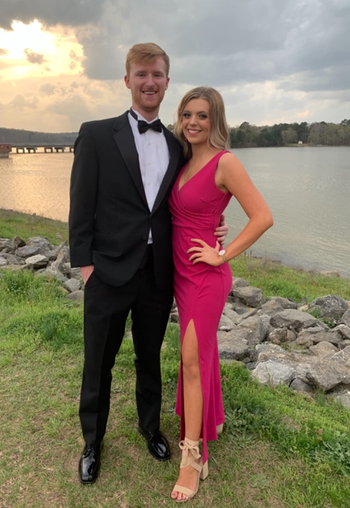reviewer wearing a pink dress with date