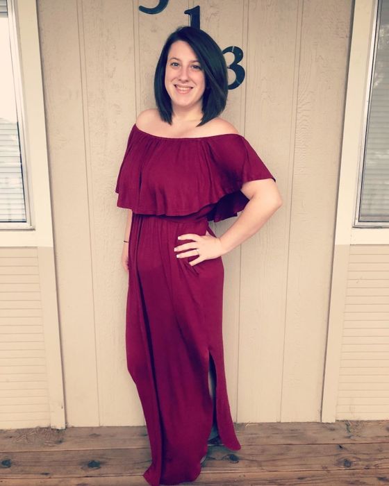 reviewer wearing the burgundy dress