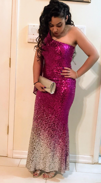 reviewer wearing a magenta dress