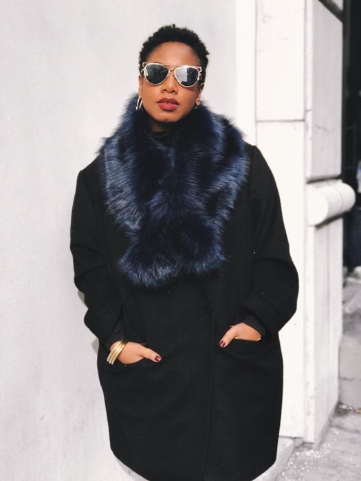 The reviewer is wearing the faux fur collar scarf in dark blue.