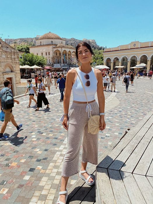 reviewer wearing the white cropped tank