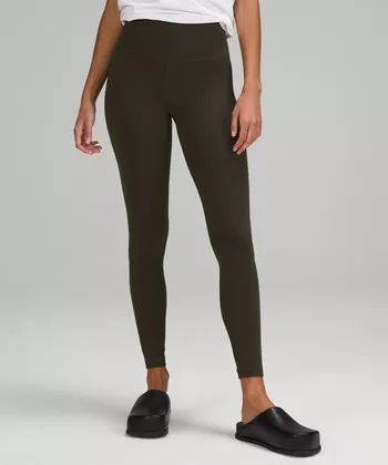 a model wearing the dark olive leggings