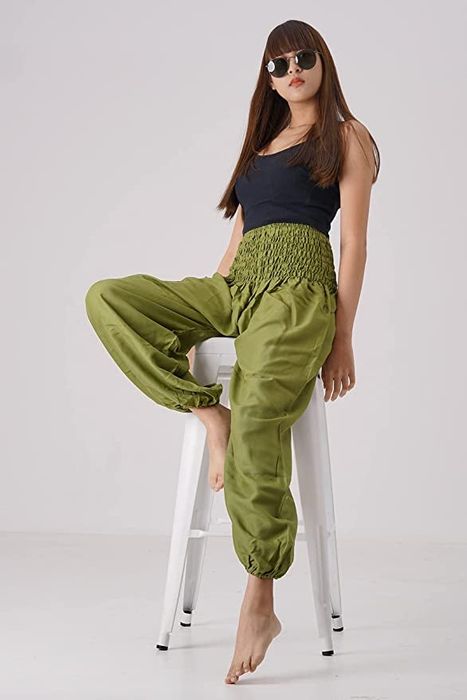 A model is featured wearing the green pants.