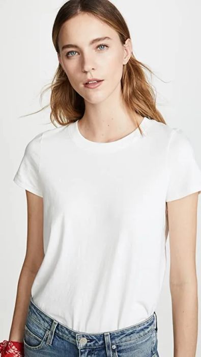 a front view of a model showcasing the white tee