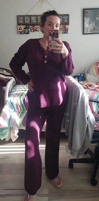 a reviewer showcasing the purple lounge set