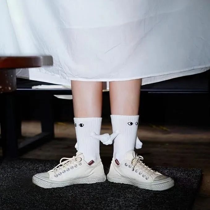 high white socks with little eyes and magnetic hands