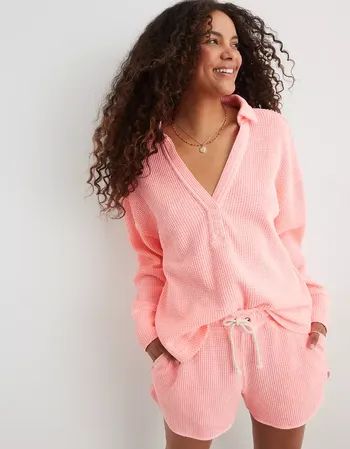 a model showcasing a pink waffle knit top