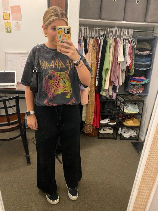 a reviewer wearing black palazzo pants