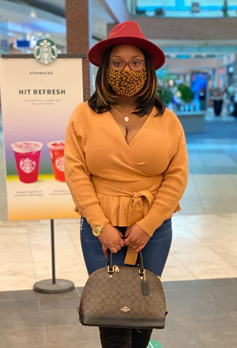 a reviewer wearing the yellow sweater
