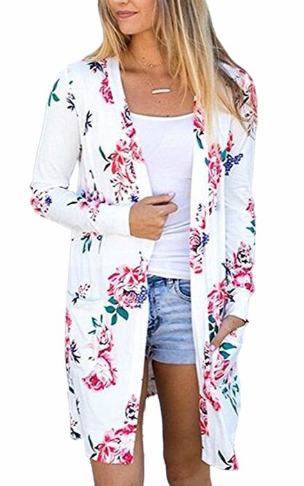 A model wearing the above-the-knee white cardigan with pink floral details
