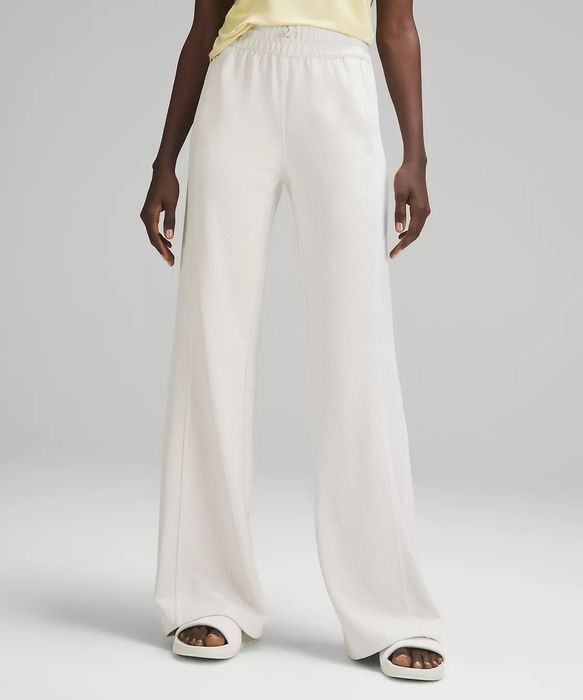 wide-legged sweats on a model in white